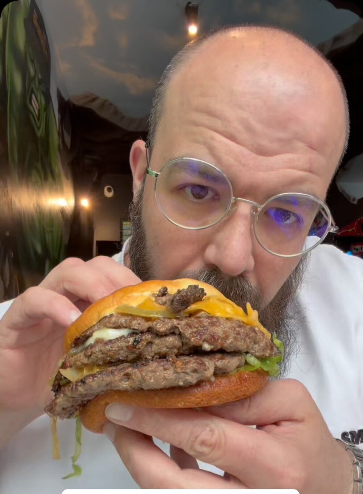 A double smash burger with cheese, pickles and lettuce